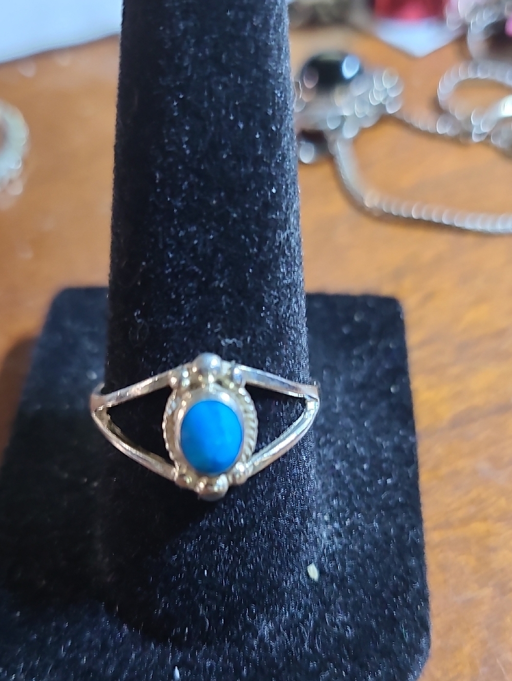 Southwest-style sterling silver ring featuring an oval turquoise cabochon